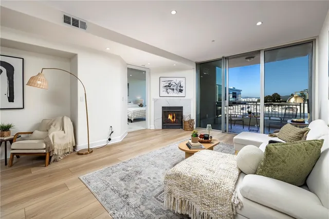 a kitchen with cabinets stainless steel appliances and a sink