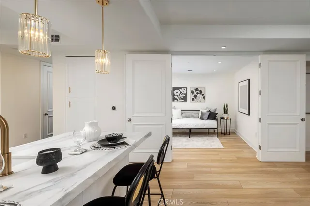 a kitchen with kitchen island granite countertop a sink and cabinets