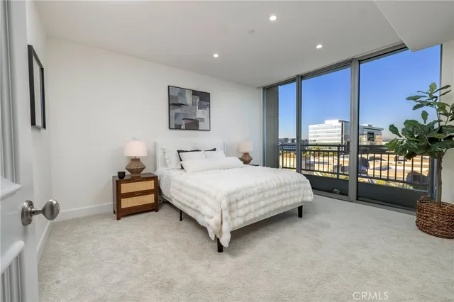 a bedroom with furniture and wooden floor
