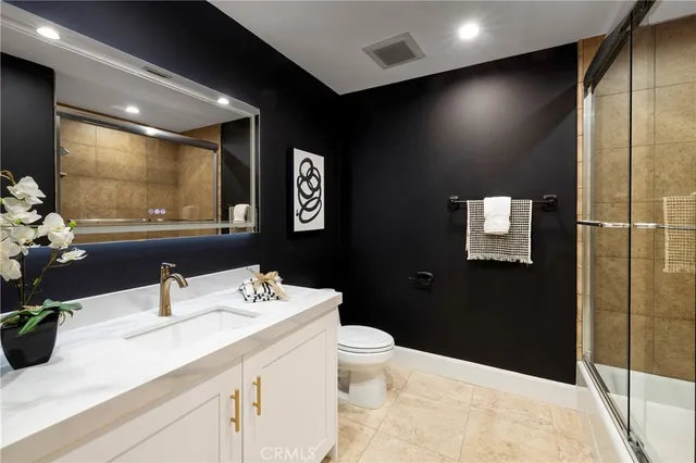 a room with gym equipment and a chandelier