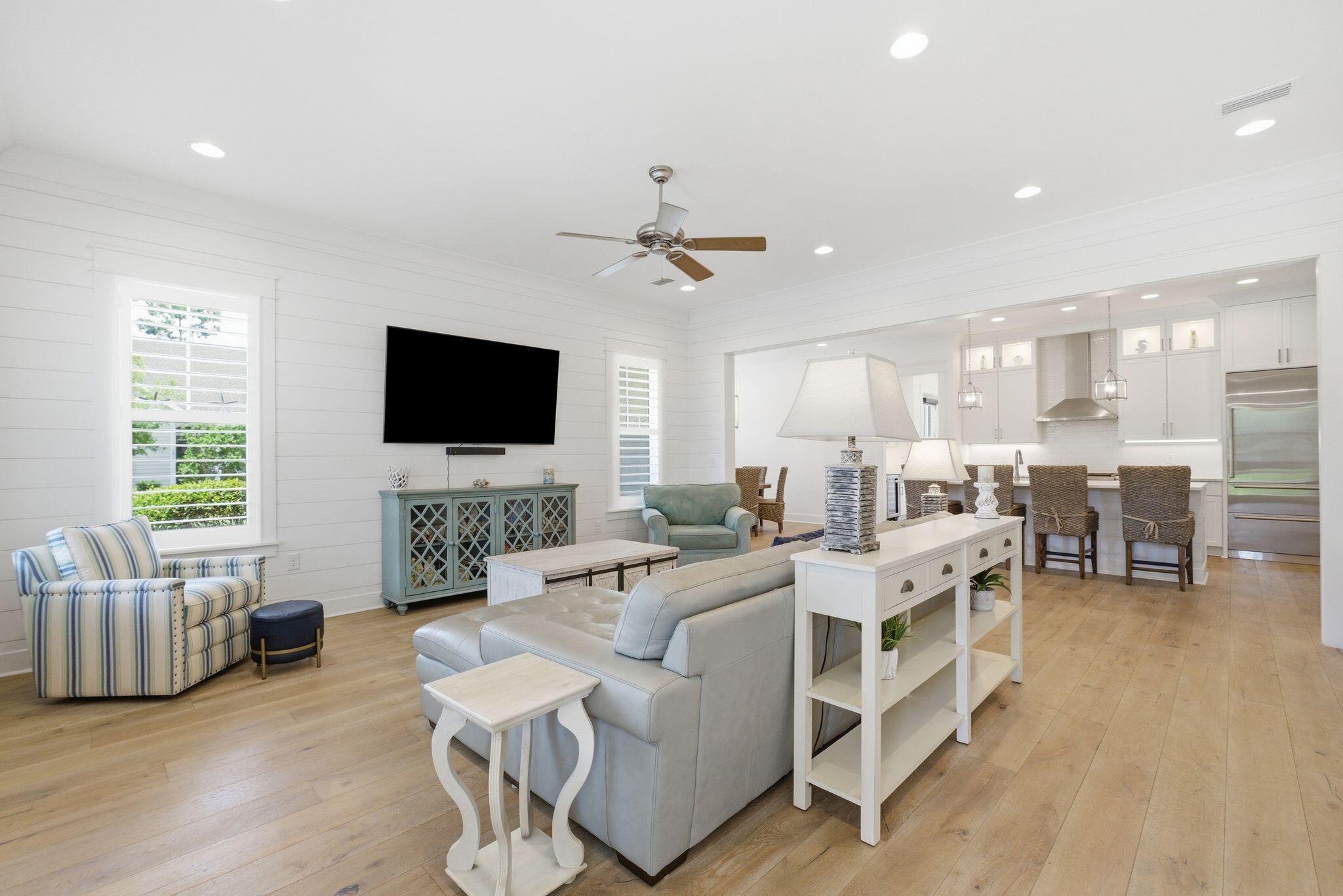 133 Sandchase Circle, Unit LOT 15 Inlet Beach, FL 32461 - Photo 6 of 47 a living room with furniture and a flat screen tv