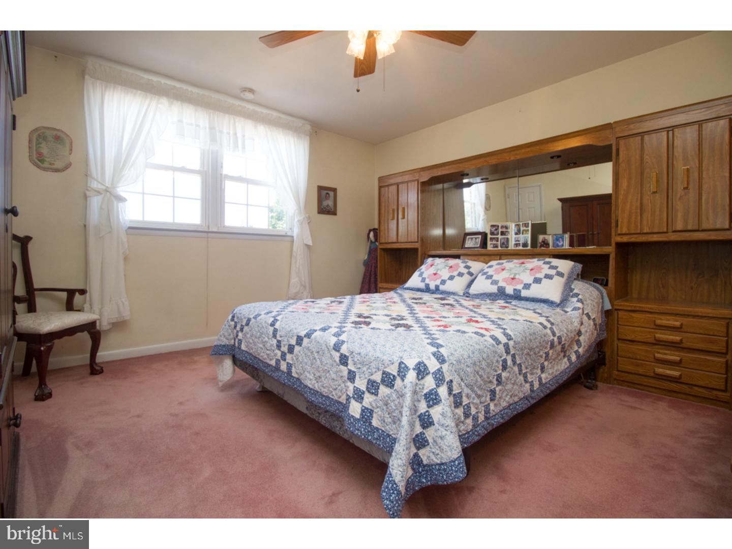3269 Comly Road Philadelphia, PA 19154 - Photo 14 of 25 a bedroom with a bed a dresser and with window