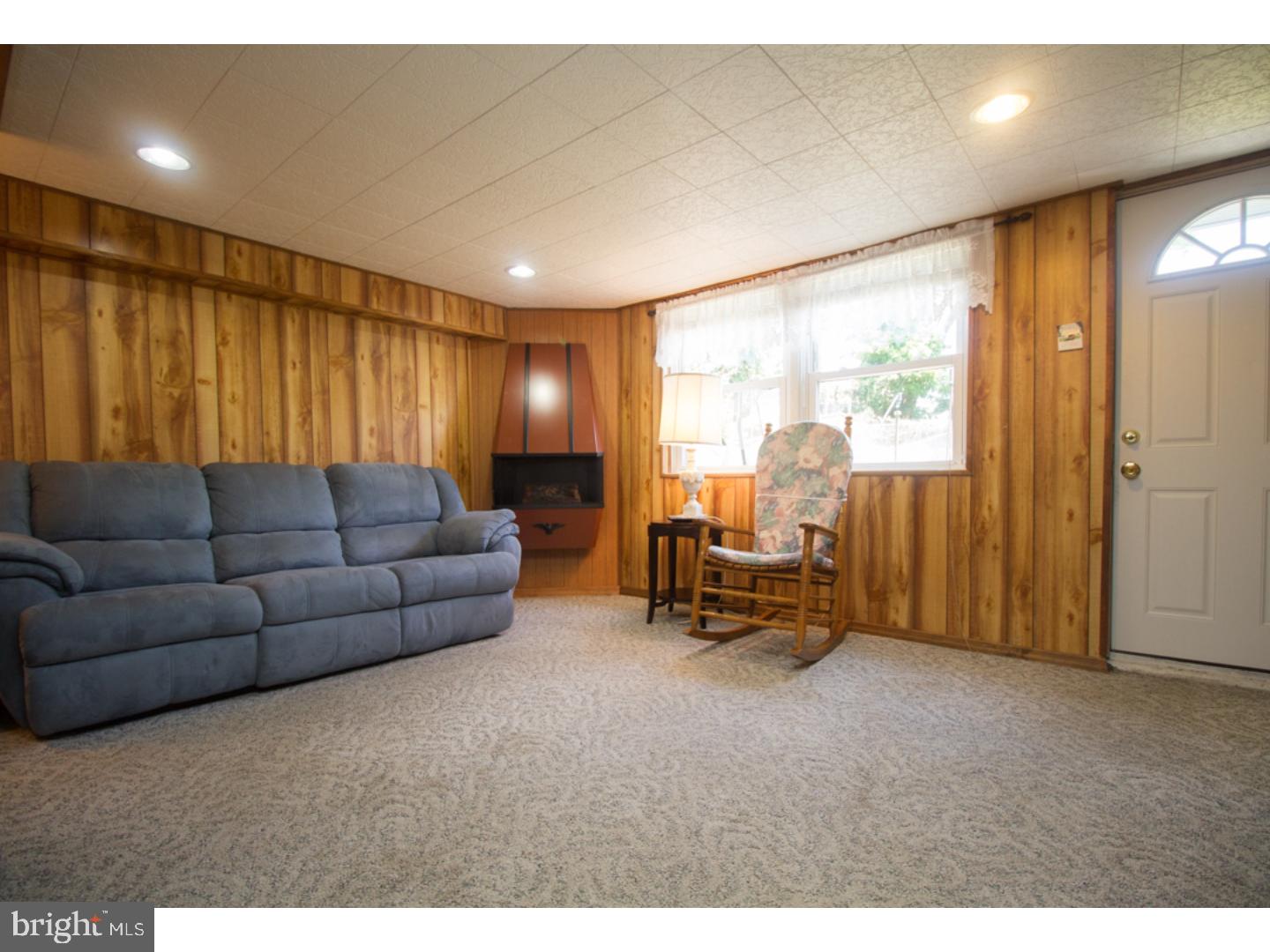 3269 Comly Road Philadelphia, PA 19154 - Photo 22 of 25 a living room with furniture and a floor to ceiling window