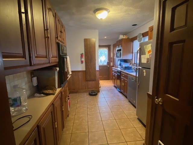 248 Shute Street Everett, MA 02149 - Photo 2 of 35 a kitchen with stainless steel appliances granite countertop a refrigerator and a stove