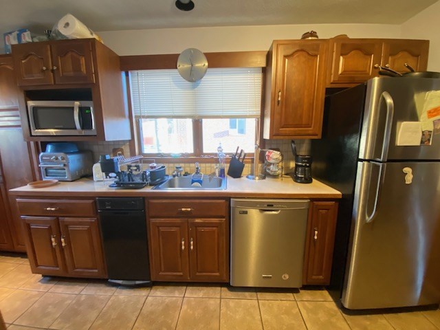 248 Shute Street Everett, MA 02149 - Photo 3 of 35 a kitchen with stainless steel appliances granite countertop a sink and a refrigerator