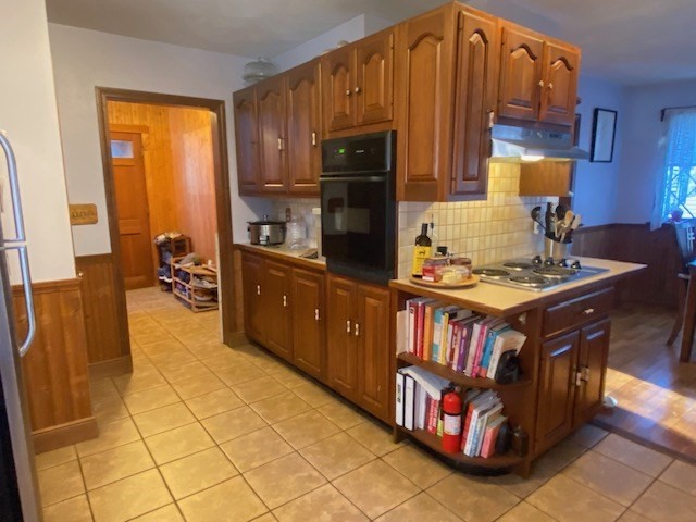 248 Shute Street Everett, MA 02149 - Photo 4 of 35 a kitchen with stainless steel appliances granite countertop a stove a sink and a microwave