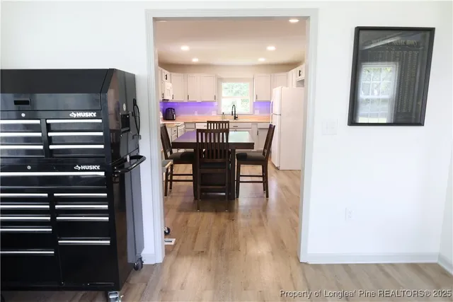 a open kitchen with a table and chairs in it