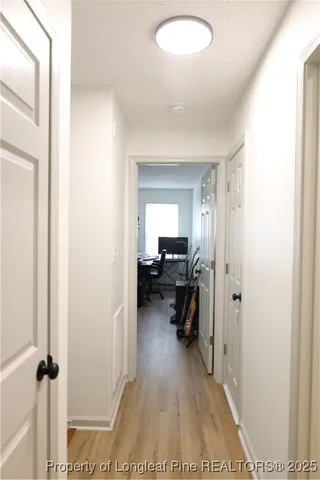 a view of a bedroom from a hallway