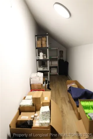 a living room with furniture and white walls