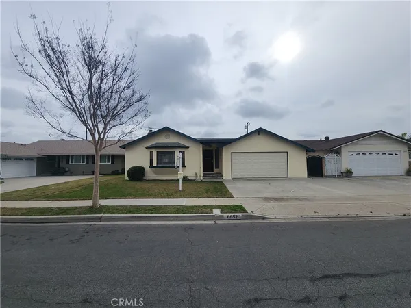 a house view with a bench in front of it