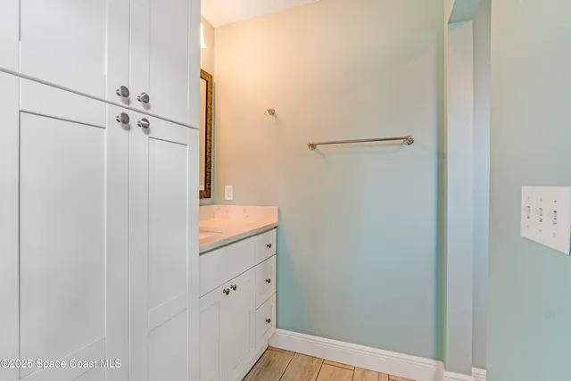 a bathroom with a shower and a sink