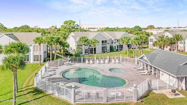 a view of a wooden wall with a swimming pool