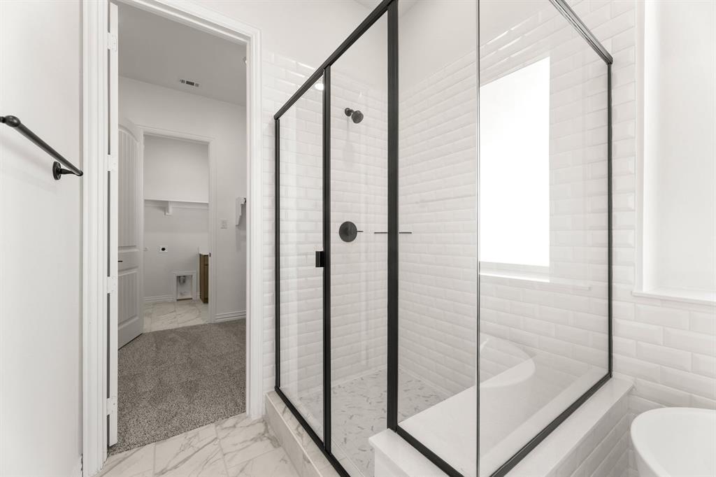 317 Slimp Bluff Azle, TX 76020 - Photo 19 of 25 a bathroom with a shower and a toilet