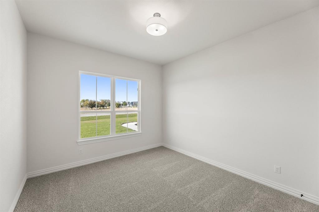 317 Slimp Bluff Azle, TX 76020 - Photo 7 of 25 a view of an empty room with a window