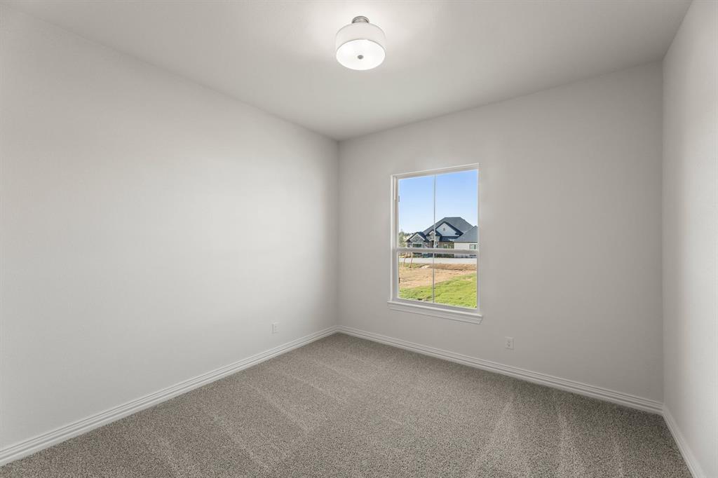 317 Slimp Bluff Azle, TX 76020 - Photo 8 of 25 a view of an empty room and a window