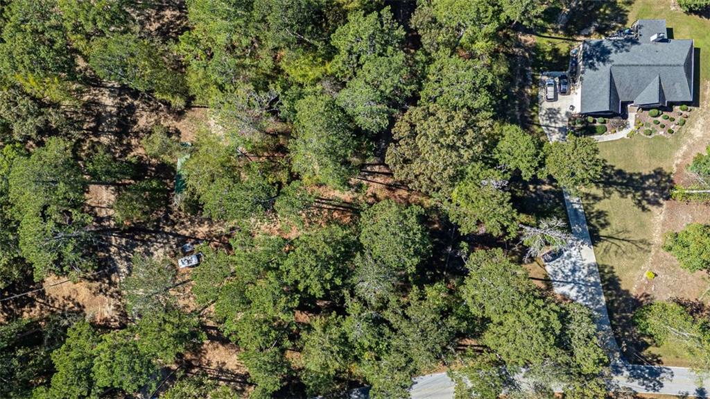 2930 Bonds Lake Road Northwest Conyers, GA 30012 - Photo 4 of 10 an aerial view of residential house with outdoor space and trees all around