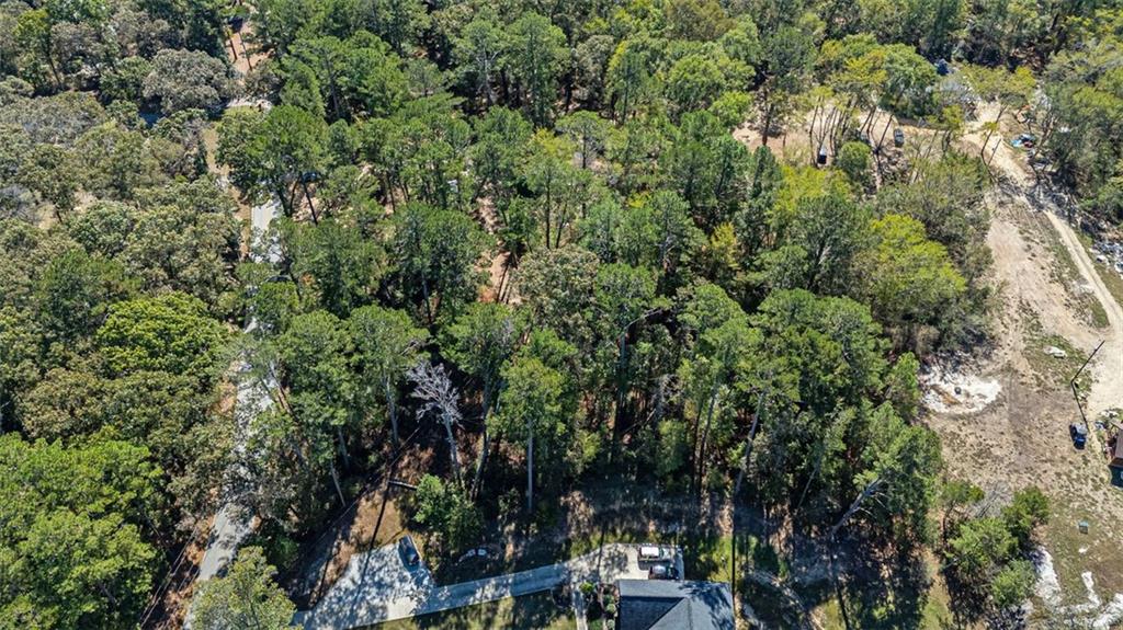 2930 Bonds Lake Road Northwest Conyers, GA 30012 - Photo 5 of 10 an outdoor space with lots of trees