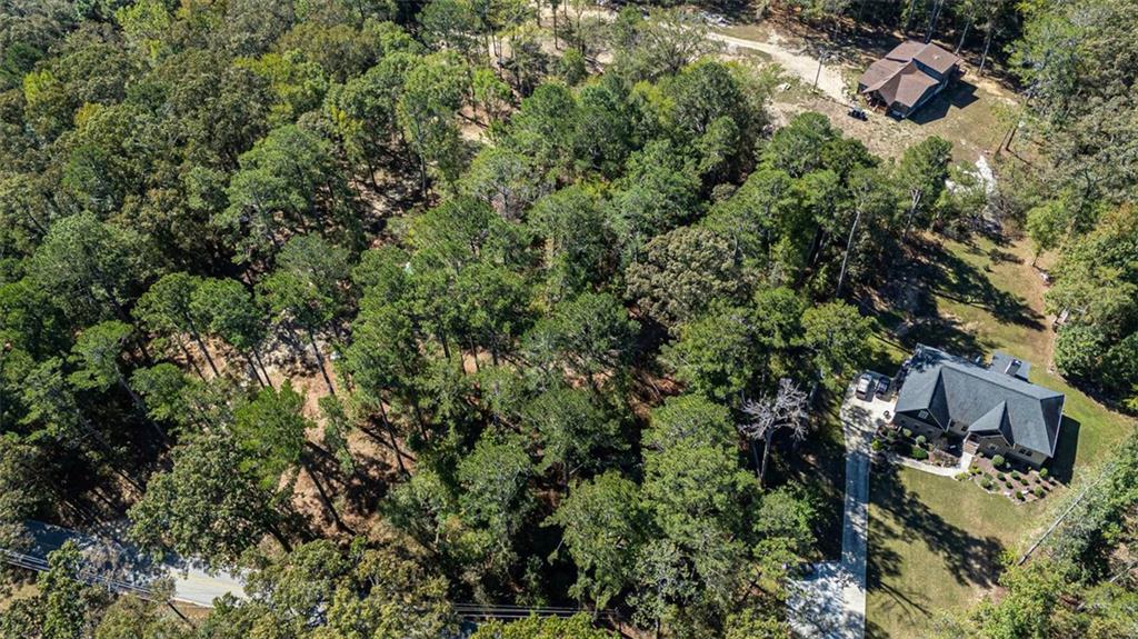 2930 Bonds Lake Road Northwest Conyers, GA 30012 - Photo 7 of 10 an aerial view of residential house with outdoor space and trees all around