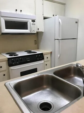 a view of kitchen and a sink