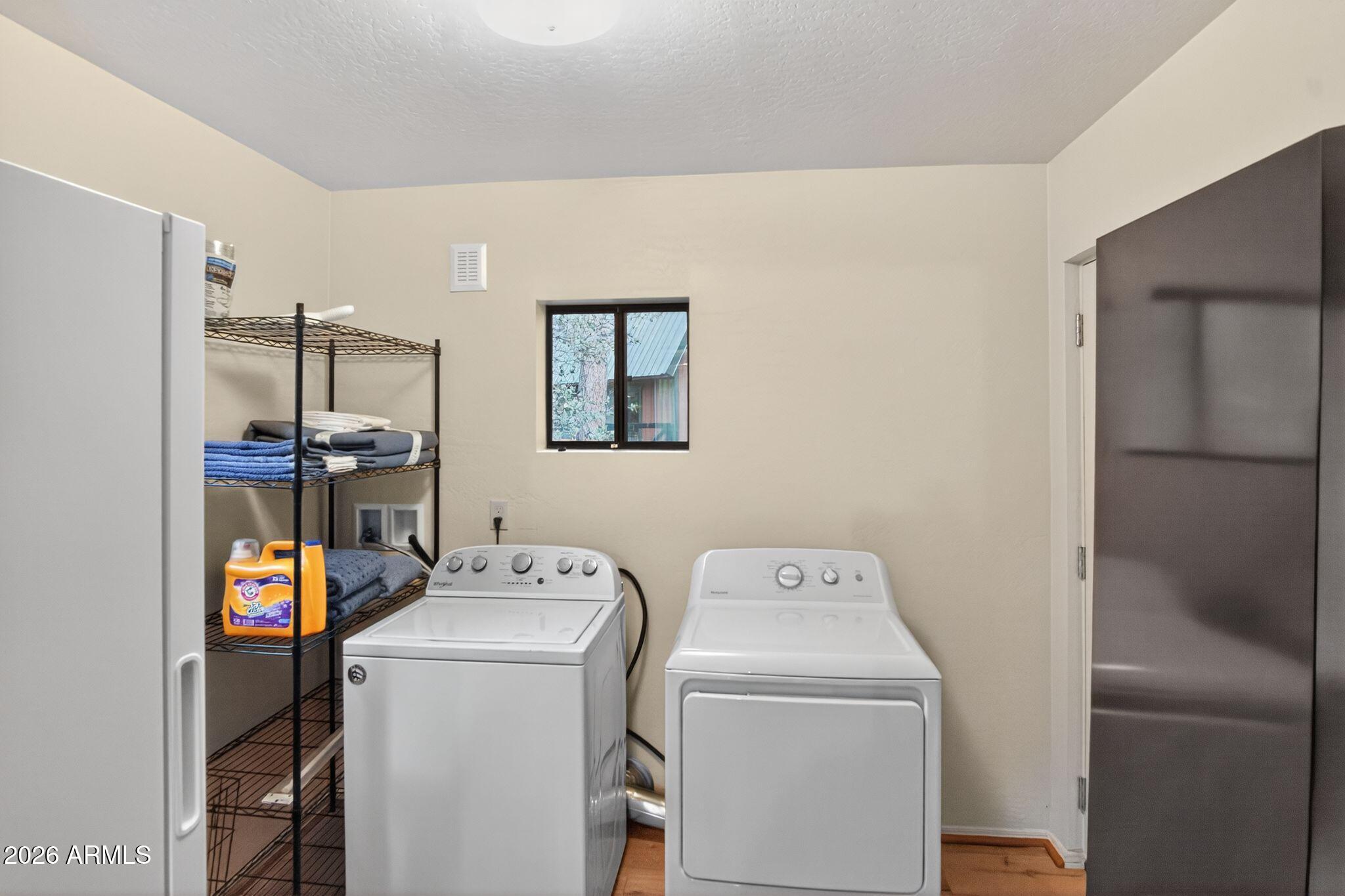 8884 Tonto Rim Drive Pine, AZ 85544 - Photo 29 of 43 a utility room with dryer and washer
