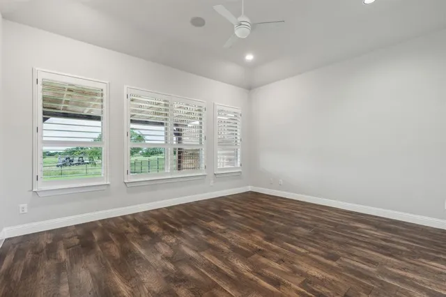 a bathroom with a double vanity sink toilet mirror and bathtub