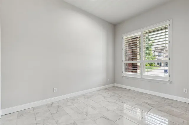 a bathroom with a granite countertop sink a toilet and a bathtub