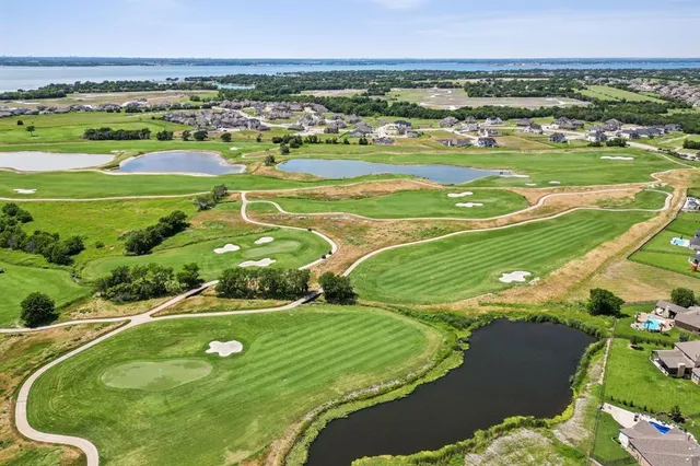 an aerial view of a pool patio patio and outdoor kitchen