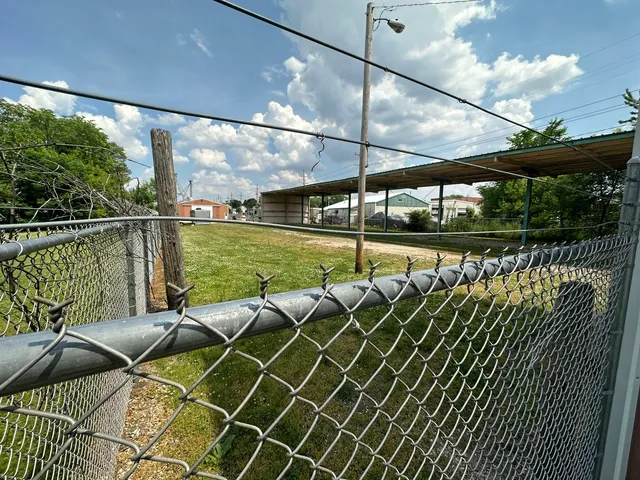 a view of a balcony with lake view and wooden floor