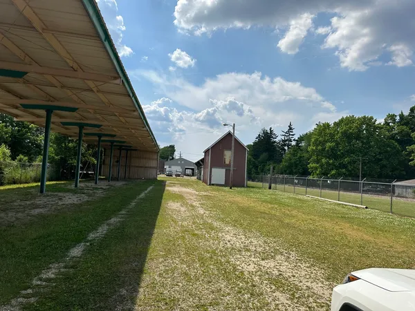 a view of a big yard with a palm tree