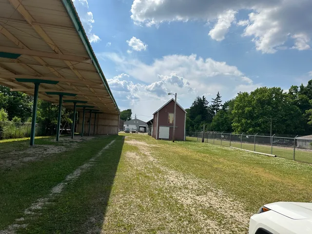a view of a big yard with a palm tree