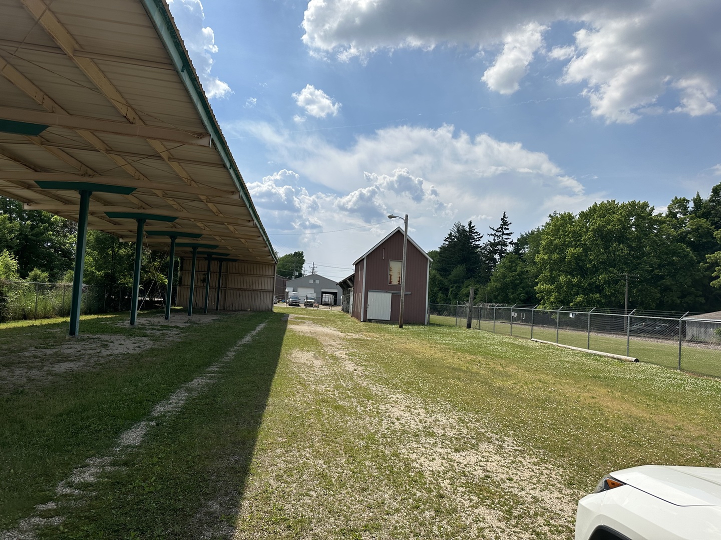 120 Monroe Street Genoa, IL 60135 - Photo 4 of 8 a view of a big yard with a palm tree