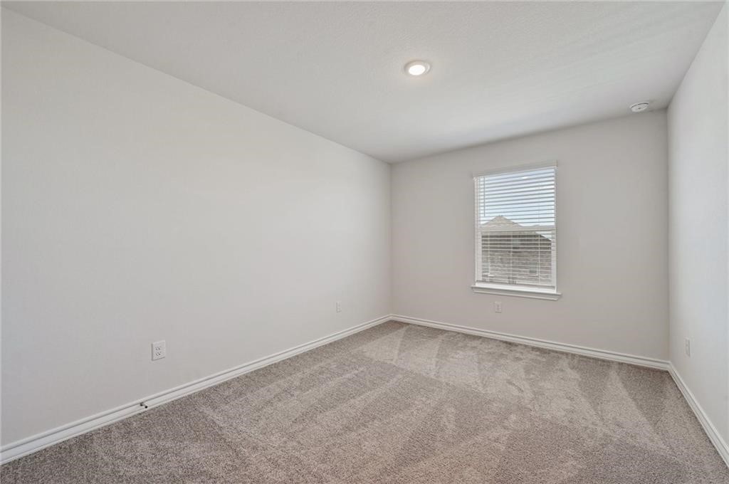 806 Pepperbark Loop Buda, TX 78610 - Photo 16 of 39 an empty room with a window