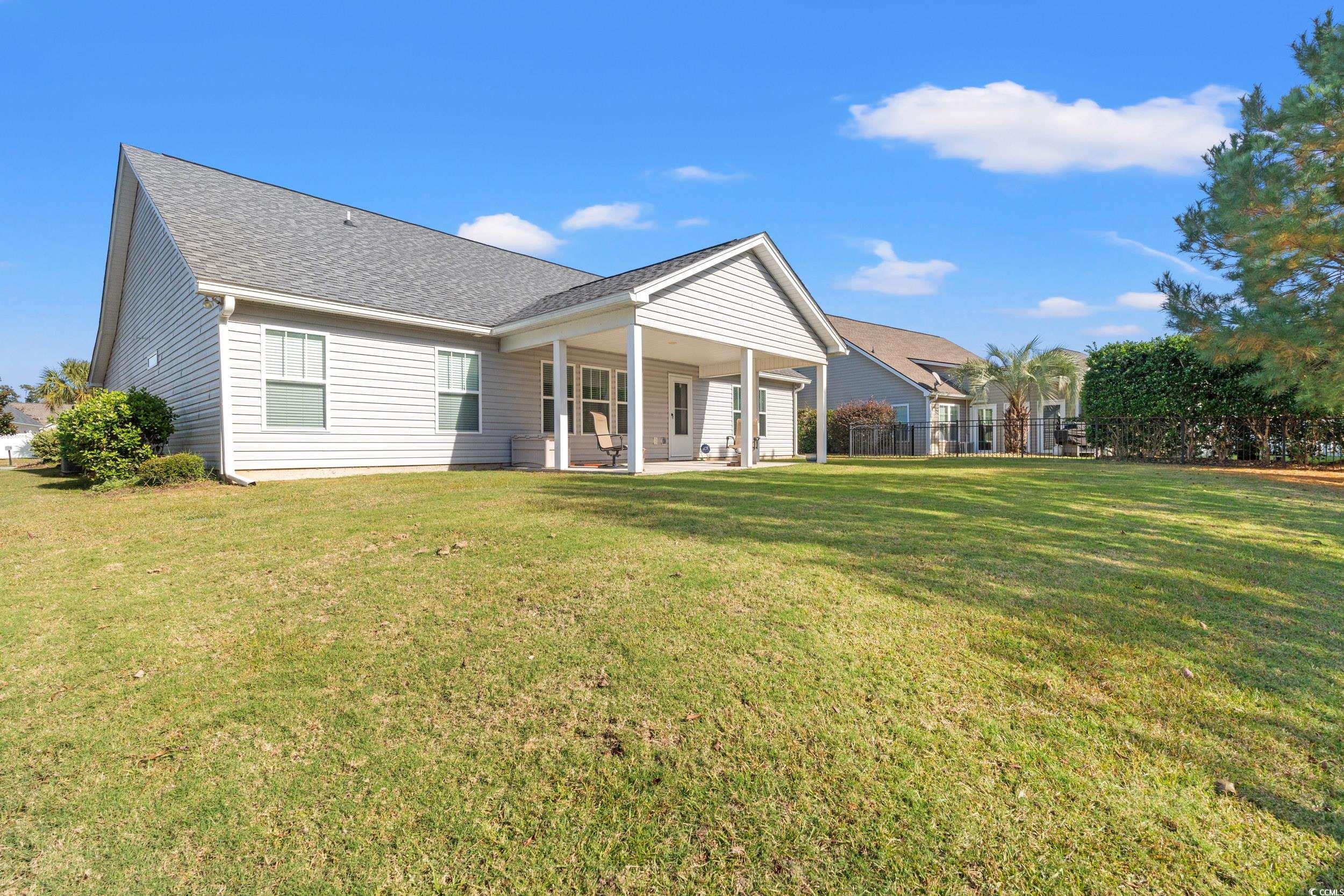132 Fox Den Drive Murrells Inlet, SC 29576 - Photo 22 of 35 Rear view of property with a patio and a shingled roof
