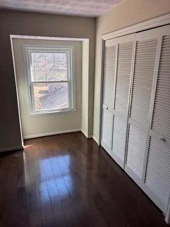 a bathroom with a toilet and a shower curtain
