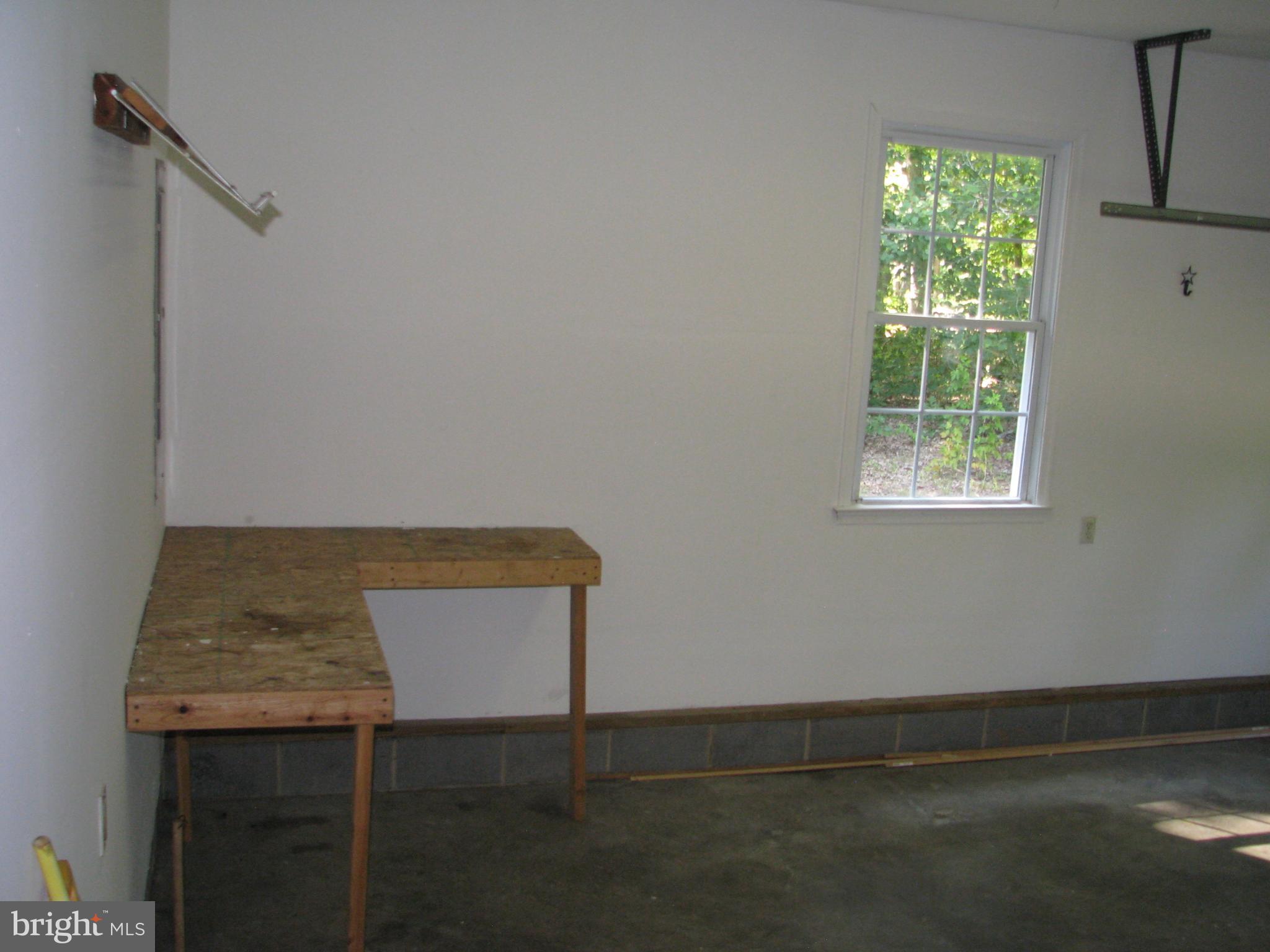 28434 Walnut Ridge Way Rhoadesville, VA 22542 - Photo 16 of 37 Work Bench in large, 2 car garage