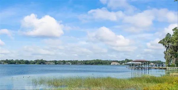 a view of a lake with houses in the back