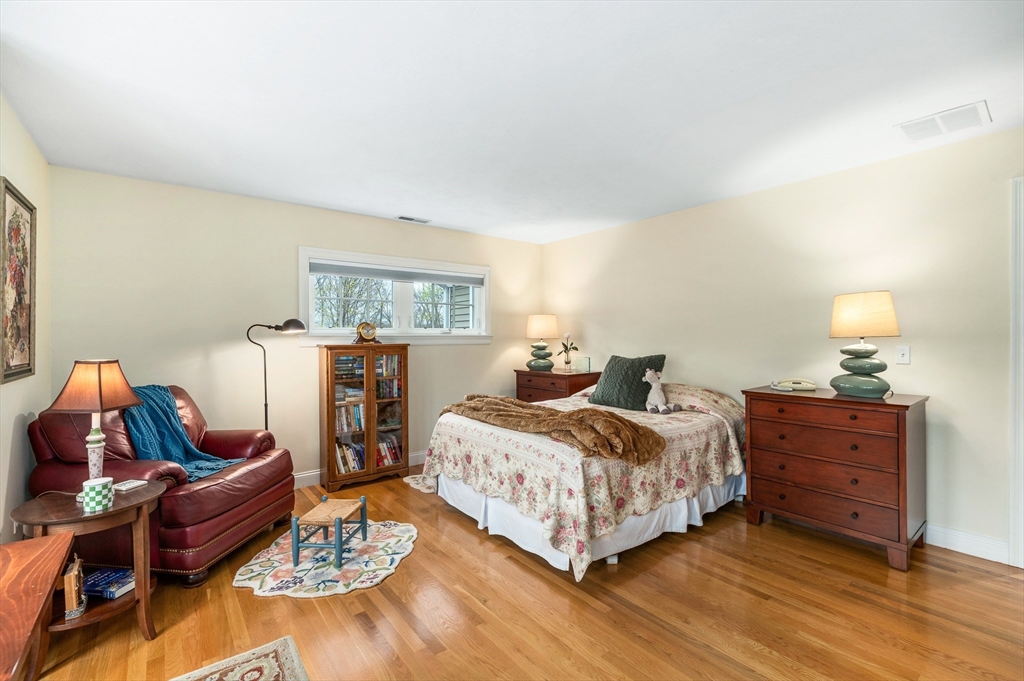 6 Essex Road, Unit 8 Ipswich, MA 01938 - Photo 23 of 35 a bedroom with a bed a couch and dresser
