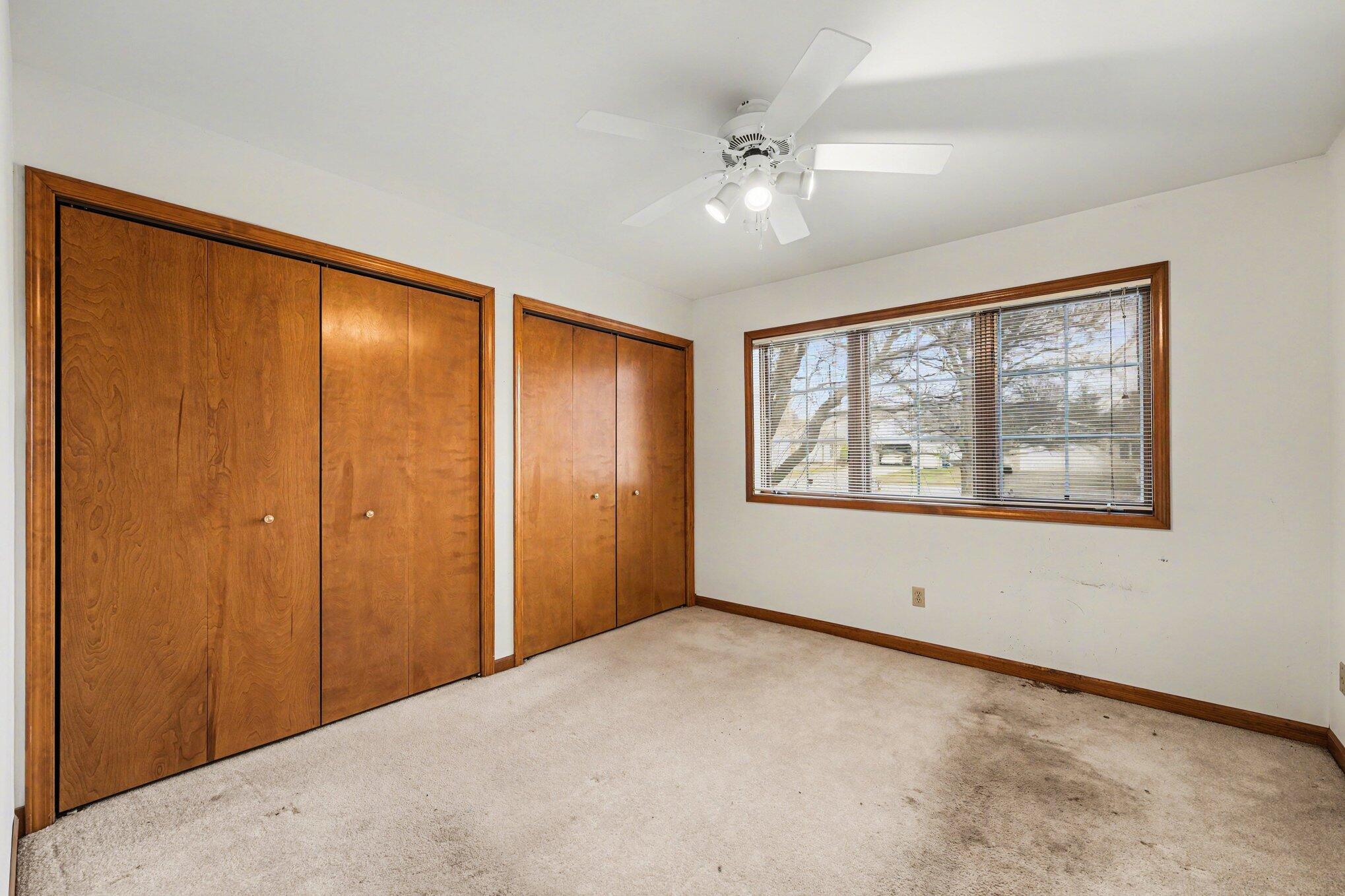 950 Blue Jay Way Dyer, IN 46311 - Photo 12 of 21 a view of an empty room with windows and chandelier fan