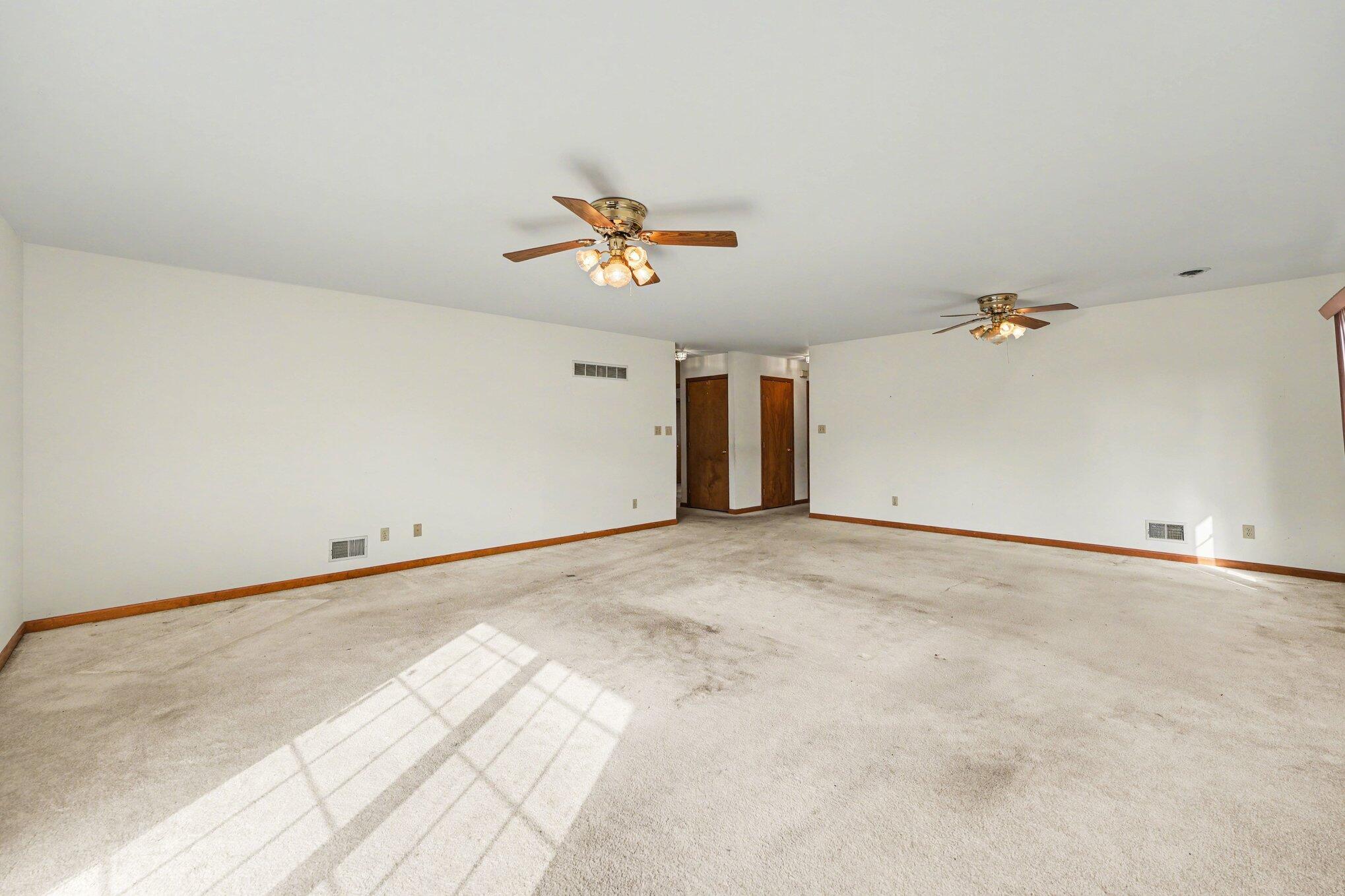 950 Blue Jay Way Dyer, IN 46311 - Photo 20 of 21 a view of a livingroom with a ceiling fan and window