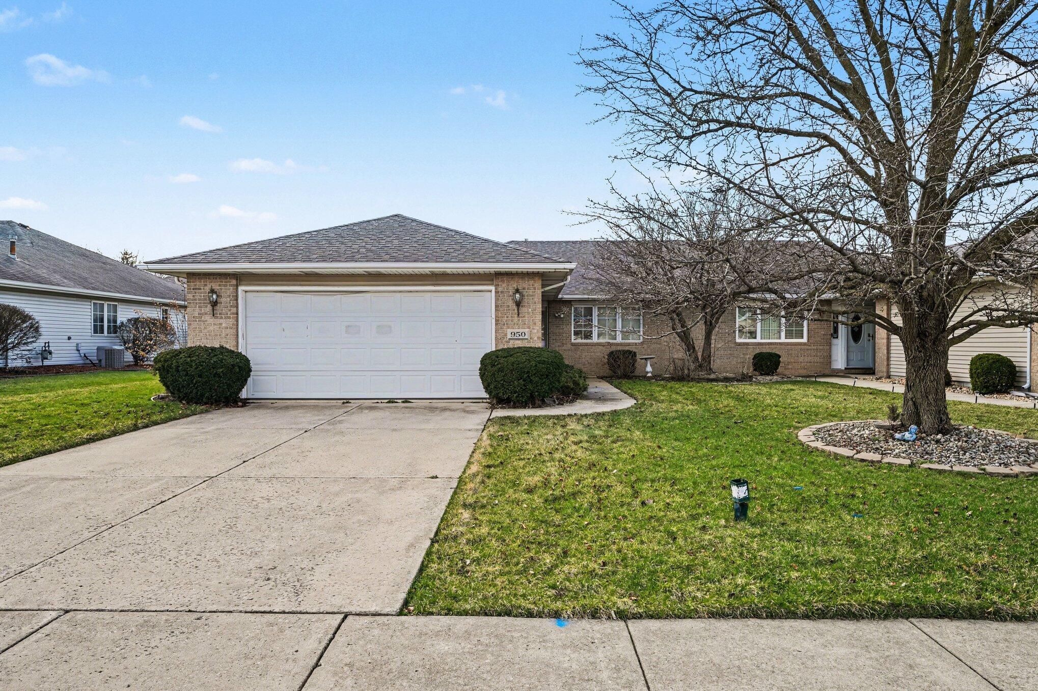 950 Blue Jay Way Dyer, IN 46311 - Photo 21 of 21 a front view of a house with garden
