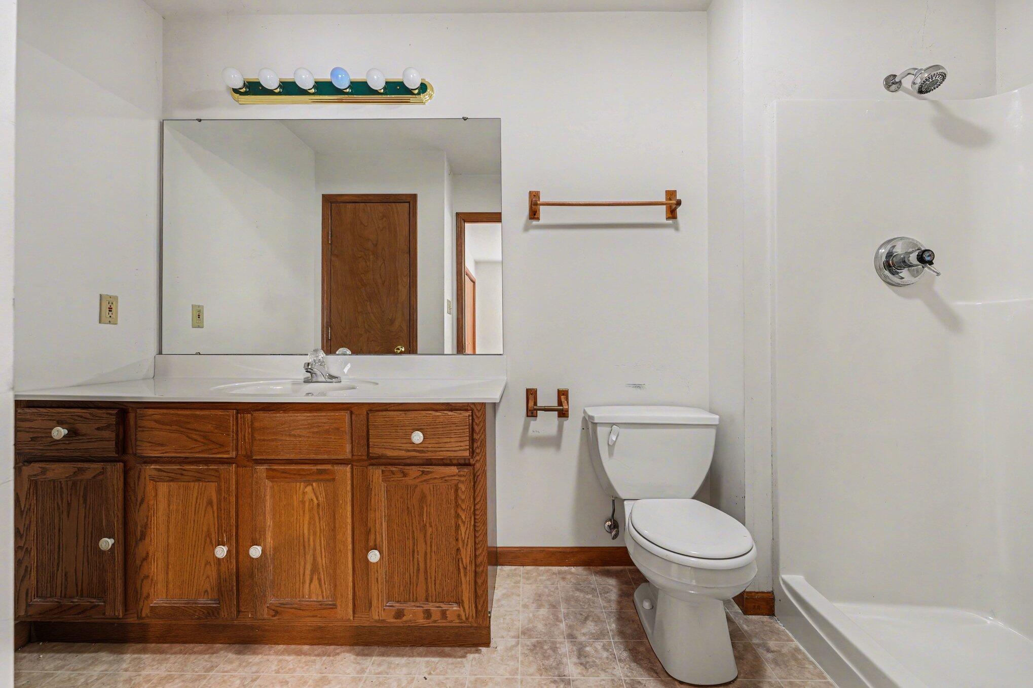 950 Blue Jay Way Dyer, IN 46311 - Photo 10 of 21 a bathroom with a toilet sink and mirror