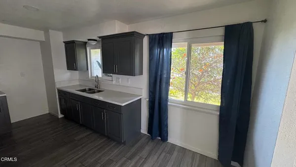 a kitchen with a sink and a window