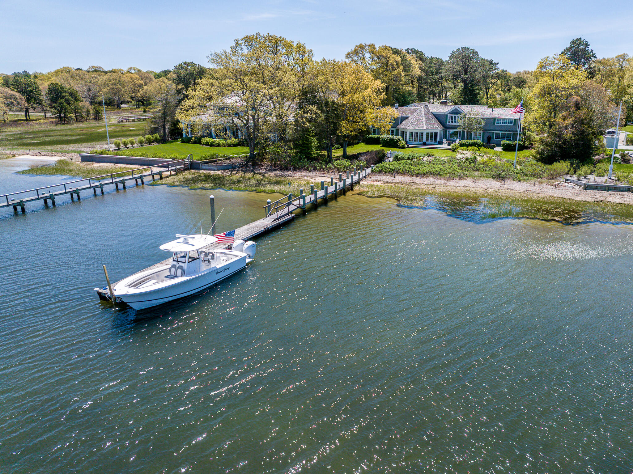 46 Great Bay Road Osterville, MA 02655 - Photo 44 of 54 a view of a swimming pool with a yard and a pond