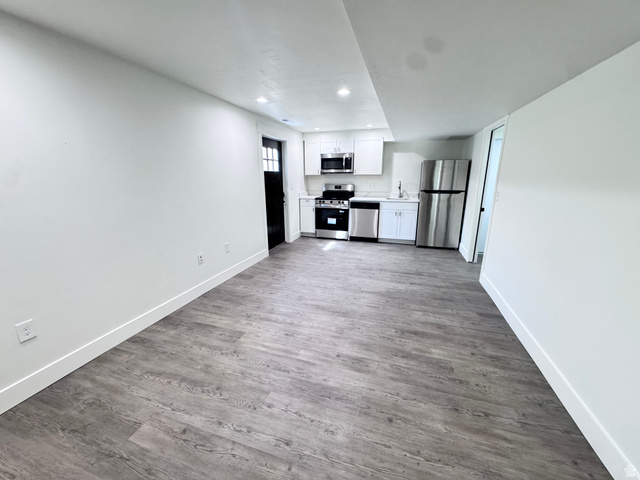 4729 Middleboro Road Herriman, UT 84096 - Photo 8 of 19 Open-concept living space featuring wood-finish flooring and recessed lighting