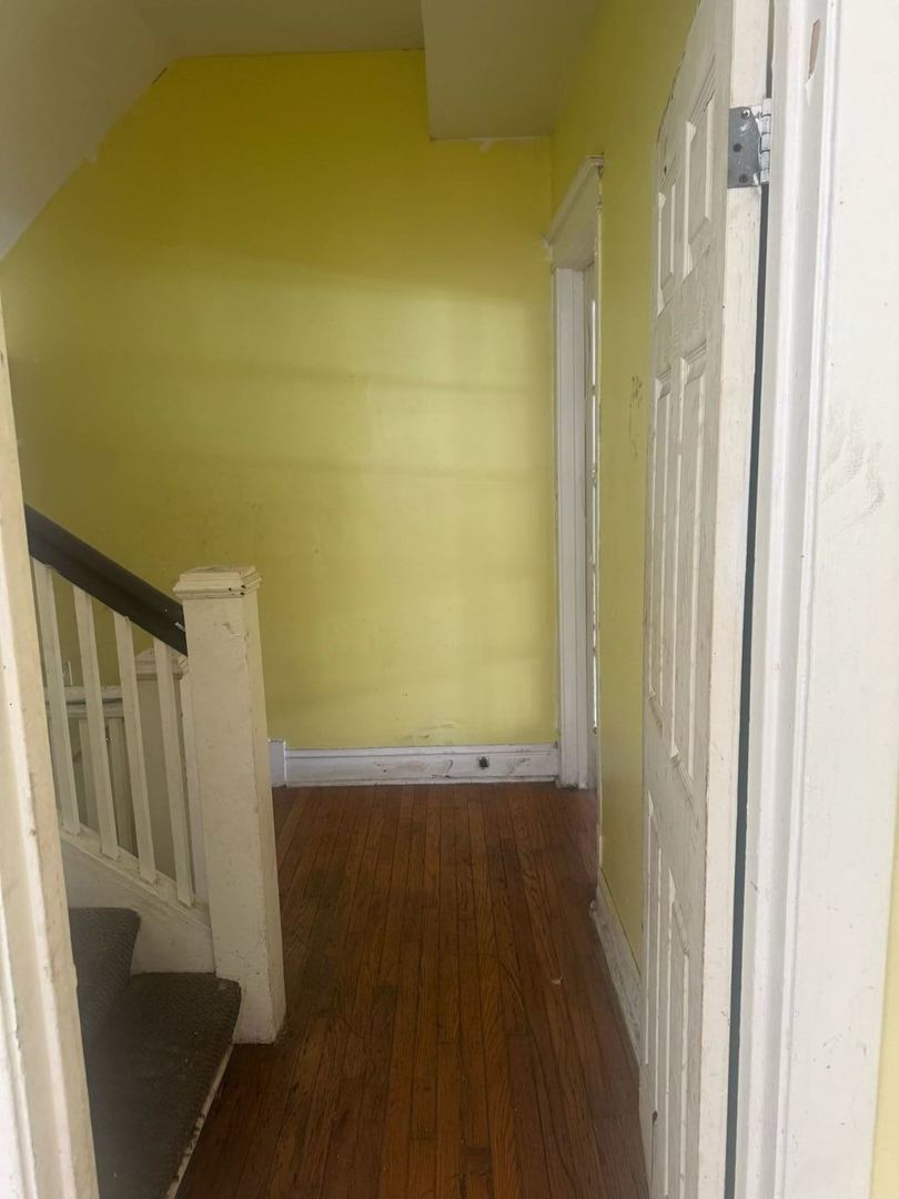 7007 South Ada Street Chicago, IL 60636 - Photo 15 of 49 a view of a hallway with wooden floor