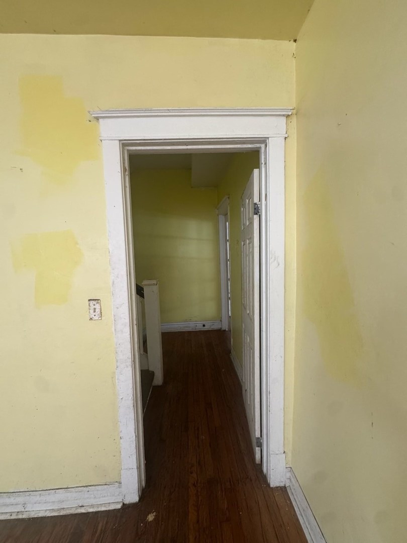 7007 South Ada Street Chicago, IL 60636 - Photo 16 of 49 a view of a hallway with wooden floor