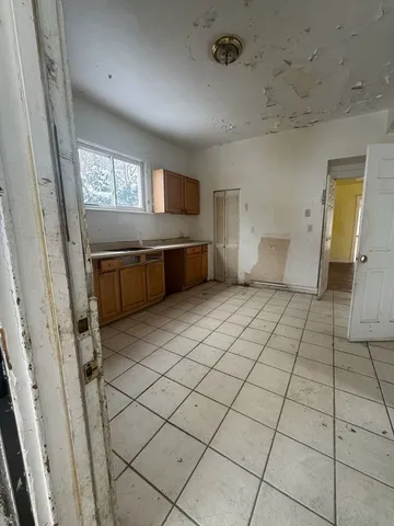 a view of kitchen with furniture and window