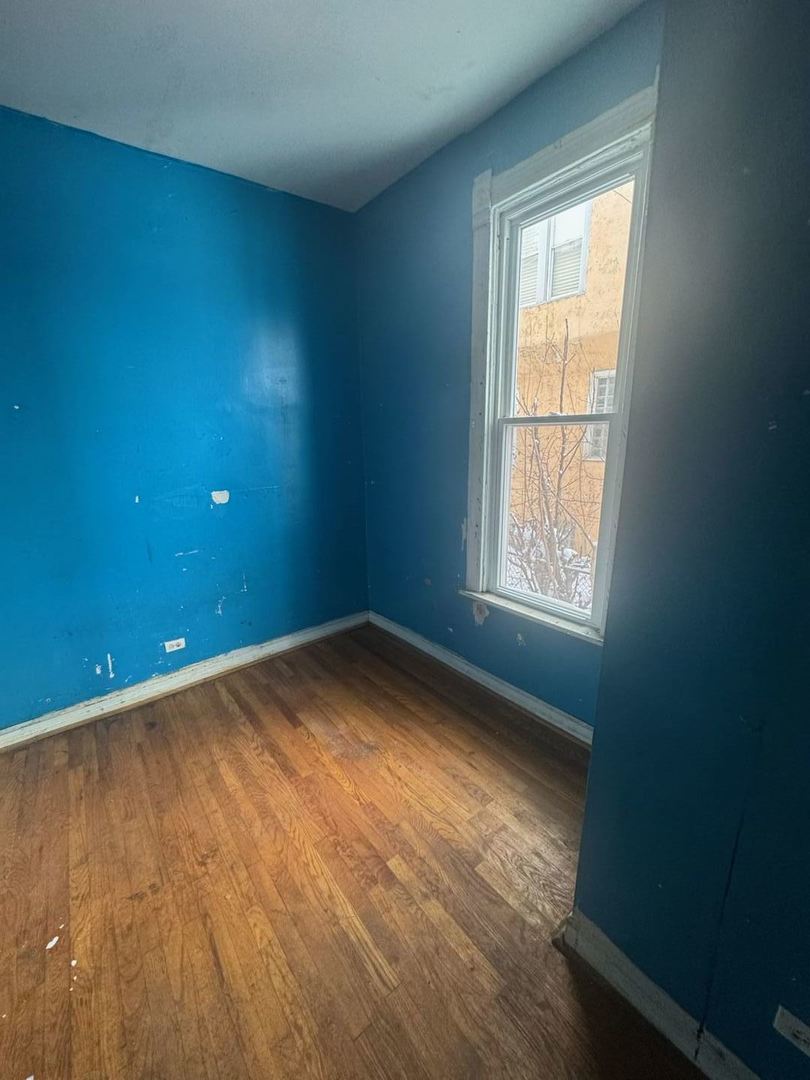 7007 South Ada Street Chicago, IL 60636 - Photo 28 of 49 an empty room with a window