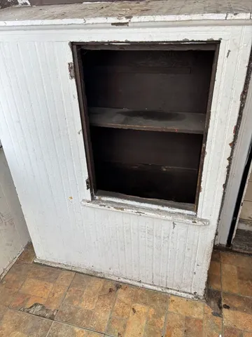 a bathroom with a bathtub and window