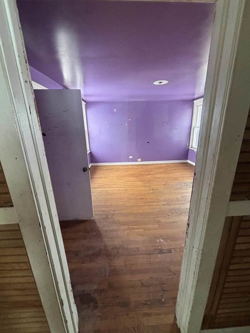 7007 South Ada Street Chicago, IL 60636 - Photo 47 of 49 a view of an empty room with wooden floor